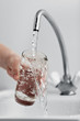 Glass pouring fresh drink water