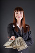 Photo: Cheerful business woman with dollars Cheerful business woman with dollars
