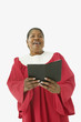 Studio shot of senior African woman wearing a choir robe and singing
