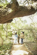 Hispanic family hiking on nature trail