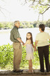 Hispanic girl with grandparents outdoors