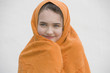 Young girl wrapped in towel