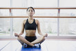 Woman meditating indoors