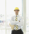 Hispanic businessman wearing hard hat