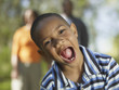 Young African boy with mouth wide open