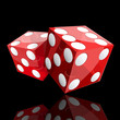two red dice cubes on black background