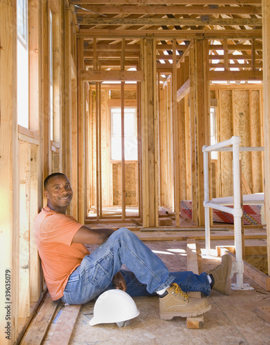 Photo: African male construction worker inside construction site African male construction worker inside construction site