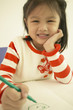 Close up of young Asian girl drawing