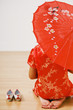 Asian woman in traditional clothing with parasol