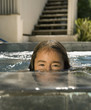 Portrait of Hispanic girl in swimming pool