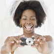 African bride taking photograph