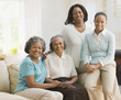 Multi-generational African women sitting on sofa