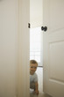 Baby looking through doorway