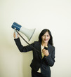 Indian businesswoman pointing megaphone at self