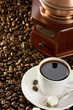 cup of coffee and grinder