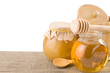 honey in jar isolated on white