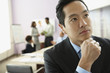 Asian businessman thinking