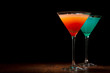 Red and blue cocktails on a black background