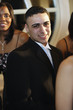 Hispanic man wearing suit at prom