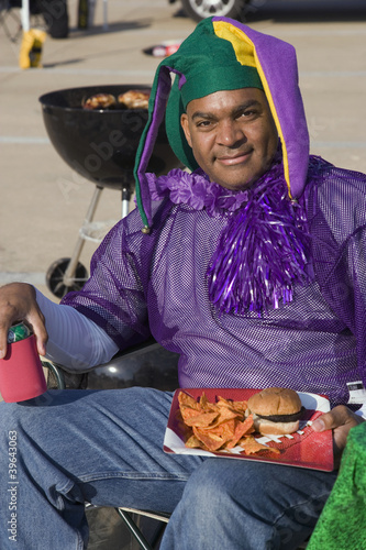 Photo: African male sports fan wearing team colors African male sports fan wearing team colors
