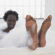 African woman in bubble bath