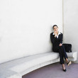 Hispanic businesswoman talking on cell phone