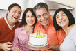 Middle-aged man celebrating birthday with friends