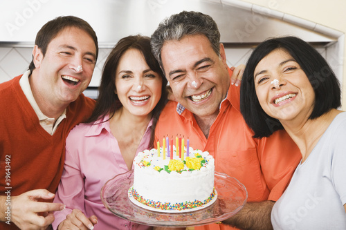 Photo: Middle-aged man celebrating birthday with friends Middle-aged man celebrating birthday with friends