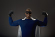 African male super hero flexing muscles