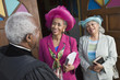Senior African American women talking to Reverend