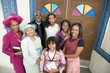 African American Reverend and parishioners in front of church