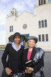 Senior African American women in front of church
