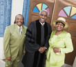 Portrait of senior African American couple and Reverend