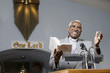 African American Reverend preaching in church