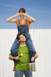 Woman sitting on boyfriend's shoulders