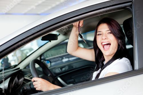 Photo: Woman buying a car Woman buying a car