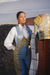 Hispanic woman wearing toreador outfit
