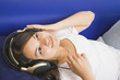 Hispanic girl listening to headphones