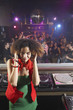 Hispanic woman djing at nightclub