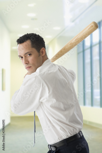 Photo: Hispanic businessman in batting stance Hispanic businessman in batting stance