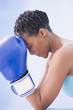 African American woman wearing boxing gloves