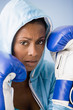 African American woman wearing boxing gloves