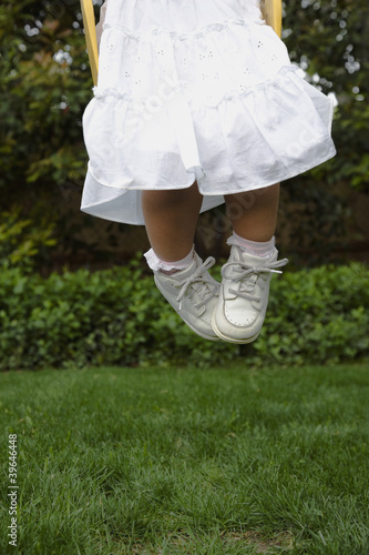 Photo: Hispanic girl jumping on grass Hispanic girl jumping on grass