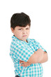 serious little boy with hands folded standing isolated on white