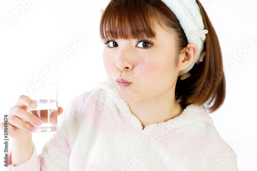 Photo: Beautiful young woman rinsing mouth Beautiful young woman rinsing mouth
