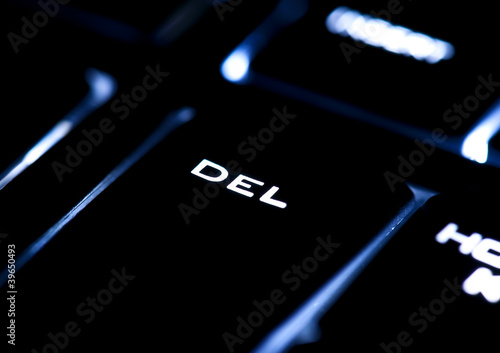 Photo: Illuminated delete button closeup shot Illuminated delete button closeup shot
