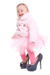 happy baby in the shoes of adults