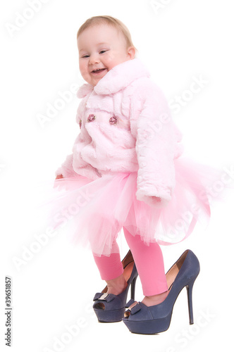 Photo: happy baby in the shoes of adults happy baby in the shoes of adults