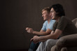 side-view of friends playing video games