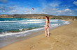 Greece.Rhodes.The young beautiful woman on seacoast...